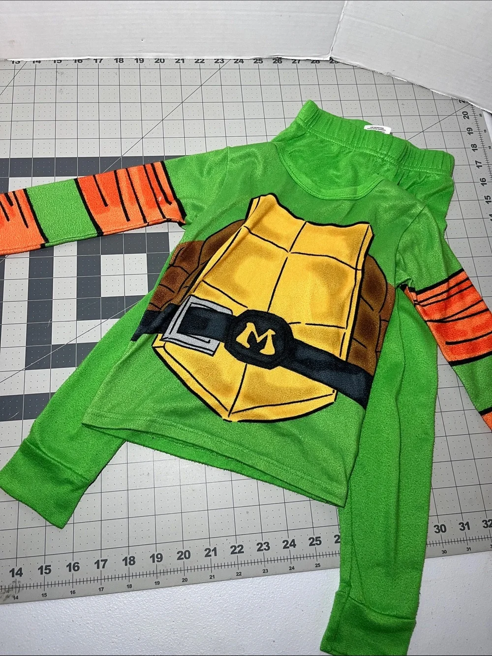 Kids Green Turtle Shell Pajama Top with Orange Sleeve Accents